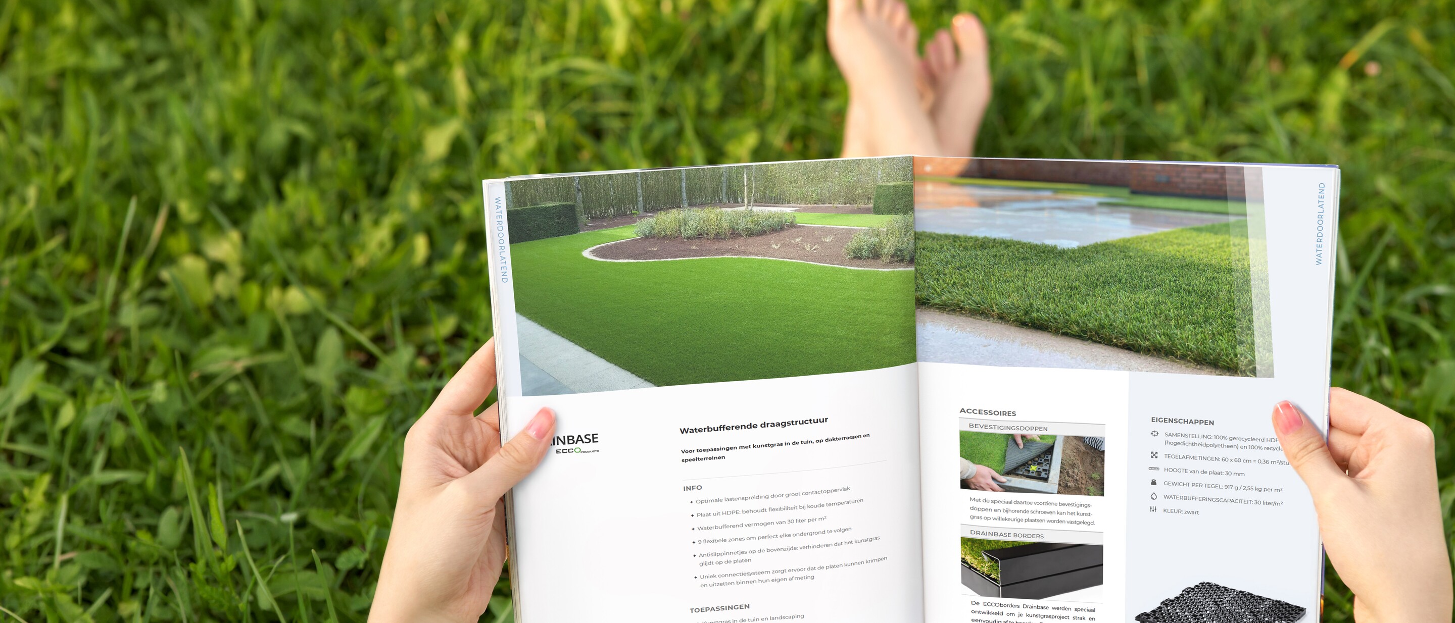 Hands holding open brochure above grass, with photos of lawn and garden materials